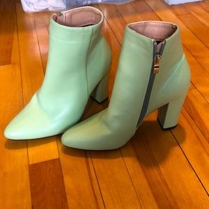 Light green booties with 3.5 inch heels